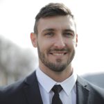 Man in Black Suit Jacket Smiling